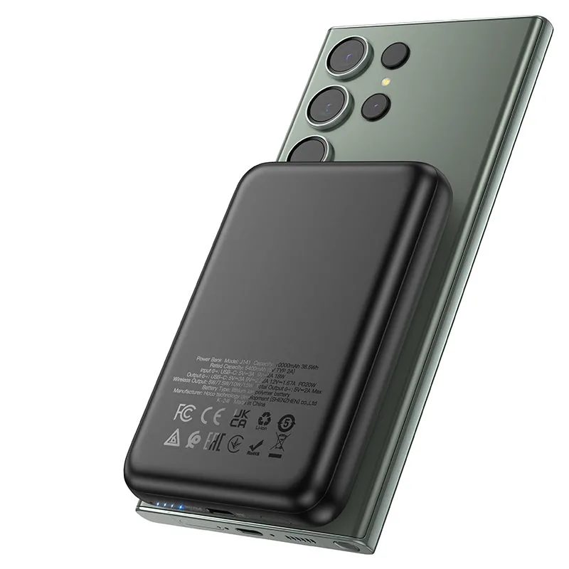 Batería magnética HOCO J141 negra pegada a un smartphone, carga inalámbrica